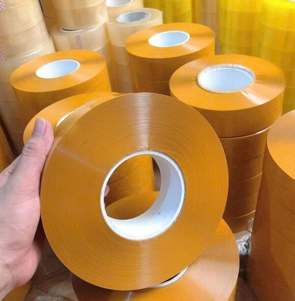 Băng dính đóng hàng. Khổ cuộn: 5cm. Khối lượng: 0.5kg/cuộn. Màu sắc: Vàng đậm - Ảnh 2